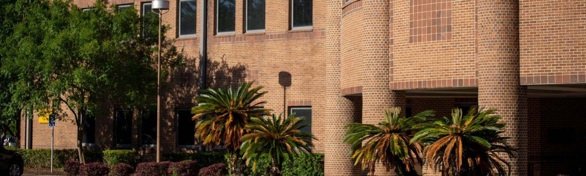 TCC seal on the brick face of the admin building