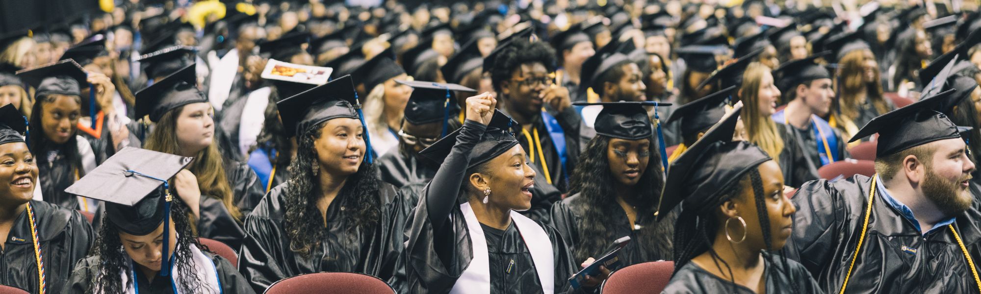 A graduate shakes hands with the President