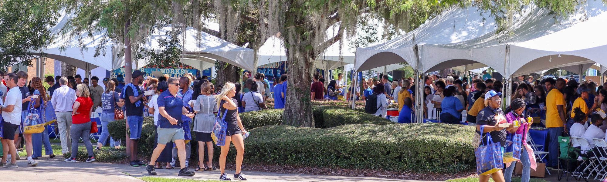 Students and parents walking around campus for convocation.